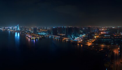 Fototapeta premium Nighttime Cityscape Illuminated Waterfront Buildings