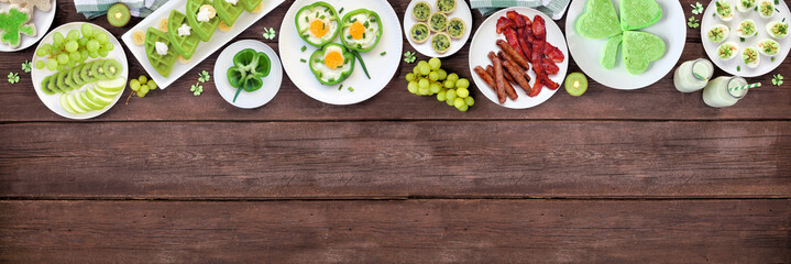 St Patricks Day breakfast or brunch top border against a dark wood banner background. Variety of...