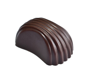 Chocolate candy with filling lies on a white background.