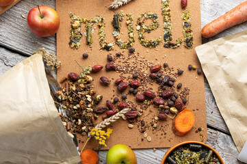 special muesli and granules for senior horses  served in bowl around muesli background.  feeding...