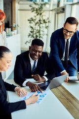 Team Collaboration During a Business Meeting in a Modern Office Environment