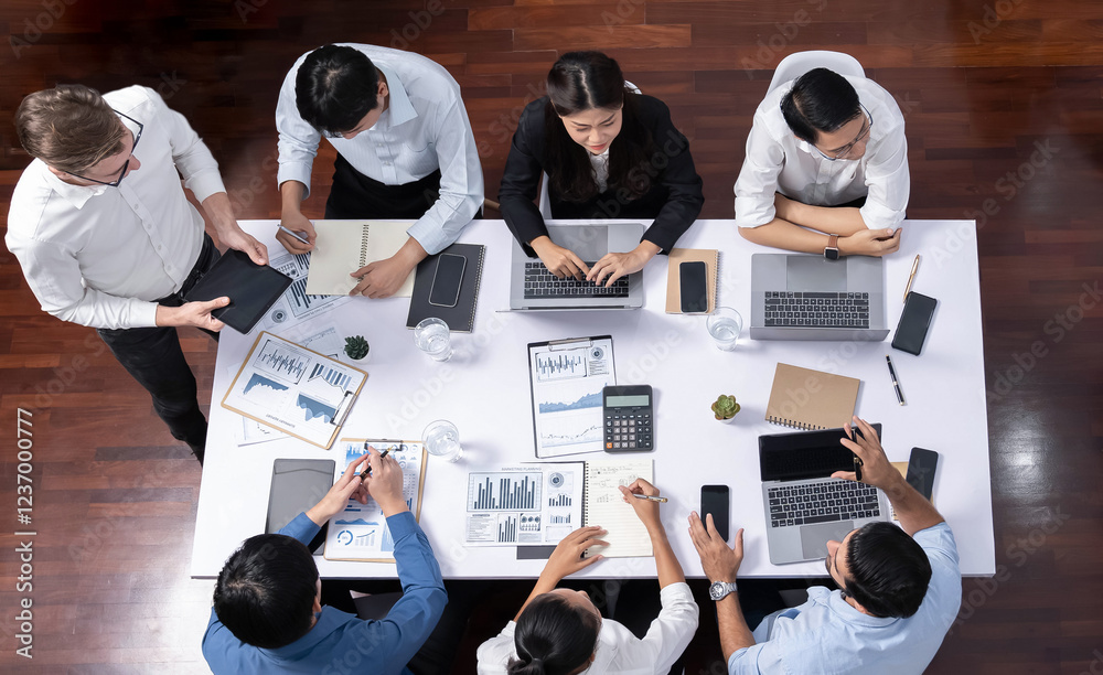 Fototapete Top view analyst team utilizing BI Fintech to analyze financial data at table in meeting room. Analytic BI dashboard power on paper for business insight and strategic marketing planning. Prudent