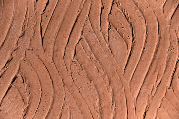 Rough deep orange plaster wall texture background. Abstract orange color texture retro style