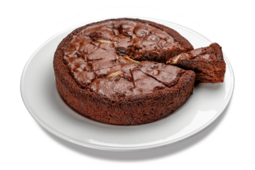 Chocolate sponge cake with slice on white plate isolated