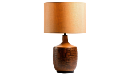 A stylish lamp features a textured brown ceramic base with a minimalist design and a warm light fabric shade, perfect for enhancing interior spaces during evening hours