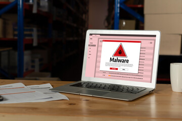 Cyber attacking concept. Malware alert showing on computer screen display scam and threat detection on computer system or online server to be removed snugly.