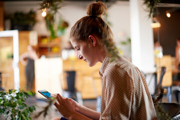 Woman, relax and tablet in restaurant for reading, digital menu or platform for service review. Customer, tech screen or internet in cafe for ebook, social media or connectivity for travel networking