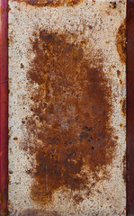 rusty flat sheet steel with peeled-off white paint leftovers
