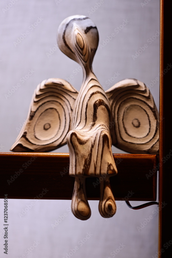 Poster a close-up shot of a wooden decorative item on a table, ideal for use in still life photography or a