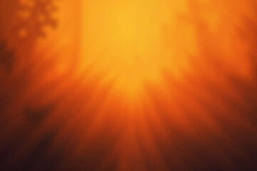 Blurred orange background with light rays. Abstract warm color, nature concept. Background for banner, card, poster, flyer. Top view.