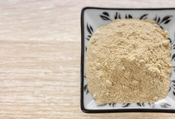 Close up photo of maca root powder, selective focus.