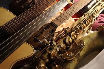 A striking image of various musical instruments, where the sleek curves of a saxophone meet the structured lines of guitar fretboards
