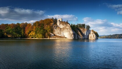 limestone slope surrounded by water of czorsztynskie lake poland europe