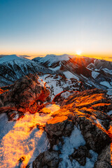 Obraz premium Winter hiking to Velky Rozsutec in Mala Fatra National park is full of beautiful views. Sunset in Slovakia mountains. Slovakia landscape