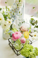Beautiful flowers in vintage vases bottles
