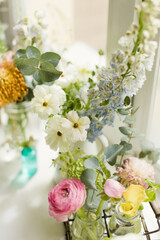 Beautiful flowers in vintage vases bottles