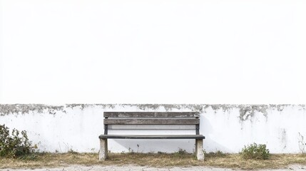 A lone park bench sits against a pure white backdrop. Its vintage concrete structure lends it an air of timeless charm.