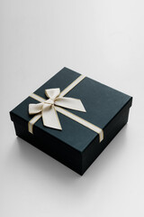 Black celebrated gift box lie on white background