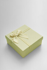 Yellow celebrated gift box lie on white background