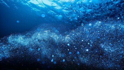 Obraz premium summary stylish detailed blue glitter debris flow with shallow depth of discipline underwater holiday magic shimmering underwater area luxury background festive sparkles and lights de targeted
