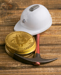bitcoin and miner's cast with a pickaxe