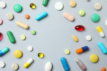 Various pills on gray background