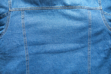 Fototapeta premium Blue denim background. Closeup view