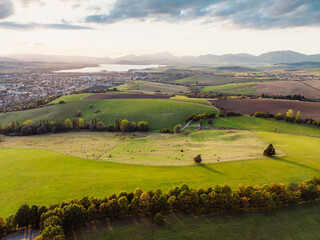 Obraz premium Sunset over Liptov region with Liptovska Mara lake and Tatras mountains around. Liptovsky mikulas landspace, slovakia.