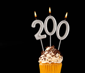 Candles forming the number 200 - Black background