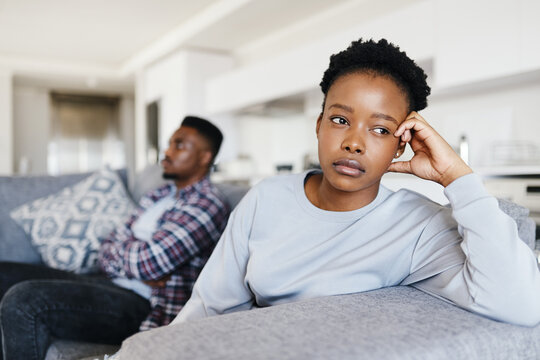 Angry, black couple and fight with stress at house of marriage conflict, bad communication and drama. People, thinking and relationship risk for divorce argument, cheating mistake and toxic betrayal