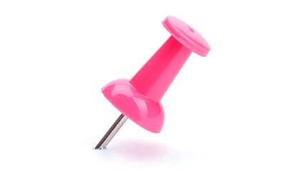 Pink push pin stuck in isolated on white background. Thumbtack mockup