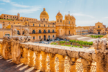 view in Noto, with the Basilica Minore di San Nicolo and Palazzo Ducezio, Sicily, Italy. Chiesa di...
