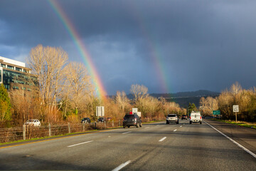 Double rainbow scene over freeway near Issaquah Washington