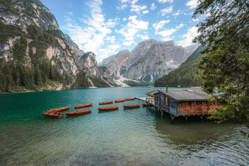 Lago di Braies or Pragser Wildsee lake with boats and fishing dock.Fanes-Sennes-Braies national park in Dolomiti Alps, South Tyrol, Italy