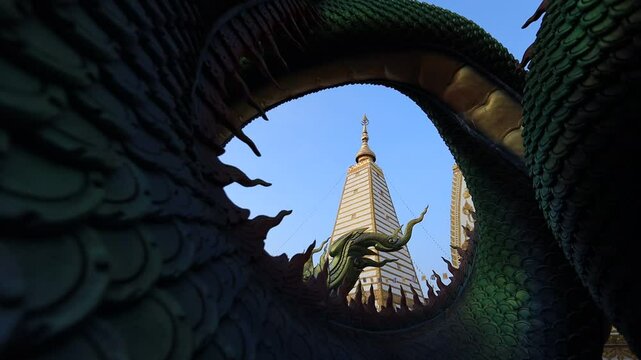 Background of the video of a religious tourist attraction, Wat Phra That Nong Bua, Ubon Ratchathani Province, Thailand. The beauty of the temple and the beautiful sculptures.