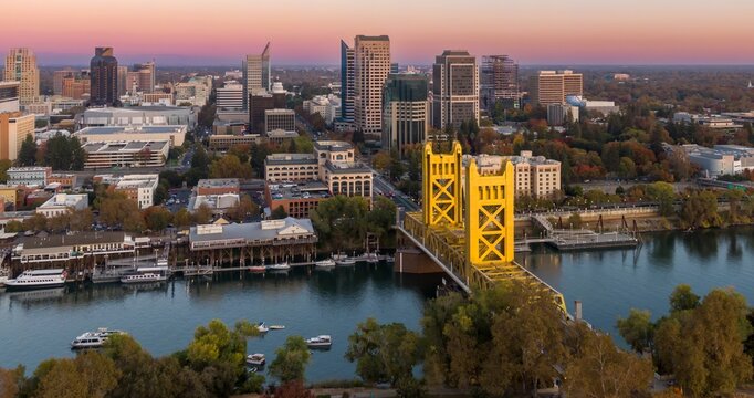 Tower Bridge, Sacramento, CA. Aerial view of the city, river, and bridge at sunset. Beautiful fall colors. Sacramento River, Sacramento, California, USA