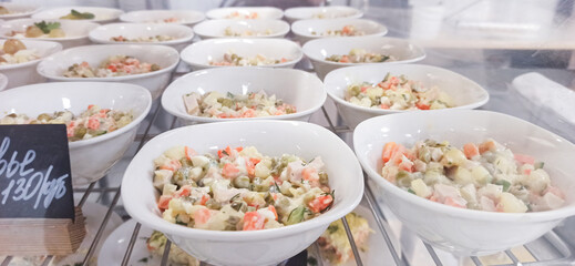 Fresh vegetable dishes arranged in bowls at a local market in the afternoon