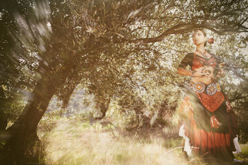 Fototapeta premium Women bellydance in nature retro dress