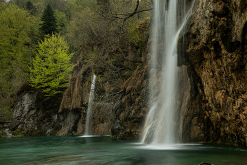 Plitvice Lakes National Park in Croatia, beautiful lakes and waterfalls between the green forest 