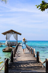 Woman walking on a pier