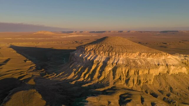 AKTAU, KAZAKHSTAN - FEBRUARY 1, 2025: Majestic view of a significant geological formation during sunset in the vast Kazakh steppe