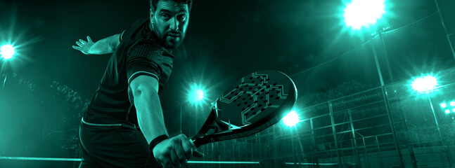 Padel Tennis Player with Racket in Hand. Paddle tenis, on a blue background. Download in high...
