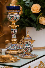 Exquisite Ornate Table Setting with Decorative Candle Holder and Teapot