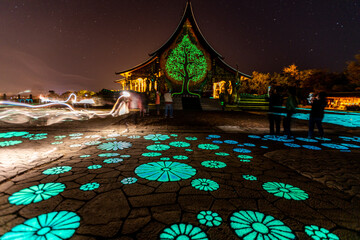 Background of the tourist attraction Wat Sirindhorn Wararam or the famous glowing temple in...