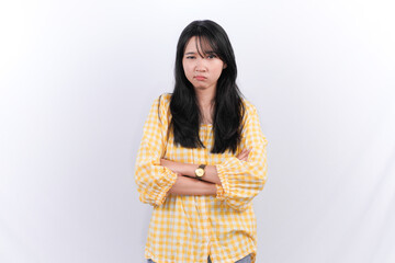 Indonesian Asian woman with long black hair is hugging herself