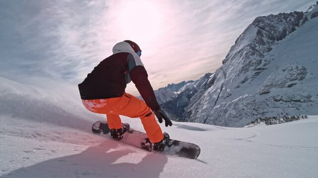 Off Piste Snowboarder Running Down. Super Slow Motion, 1000 fps. Snowboarding on Free Ride off Piste Slope in European Dolomites Mountains, Italy. 