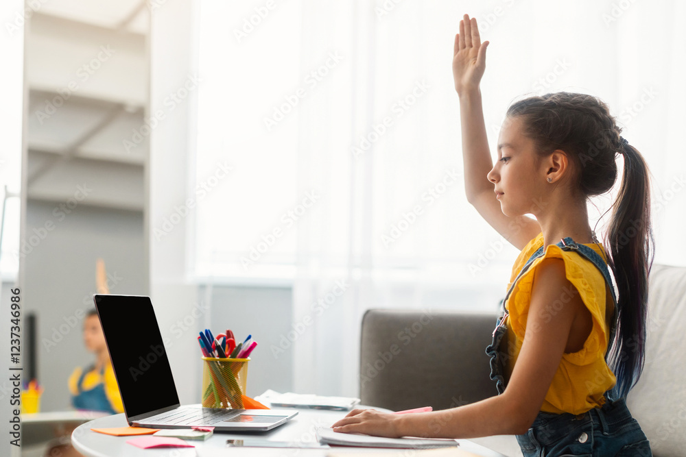 Poster homeschooling concept. profile side view of focused pupil sitting at desk on sofa, raising hand for 