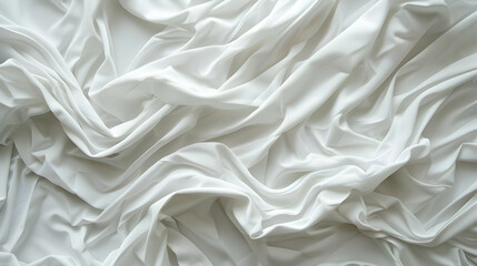 Fototapeta premium A close-up view of flowing white fabric, showcasing smooth textures and elegant draping.