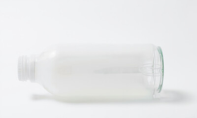 clear plastic bottle mockup lying on its side, showcasing its design and shape. Ideal for branding and packaging presentations