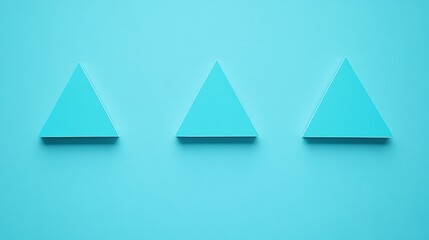 Fototapeta premium Three Teal Triangles on a Light Blue Background